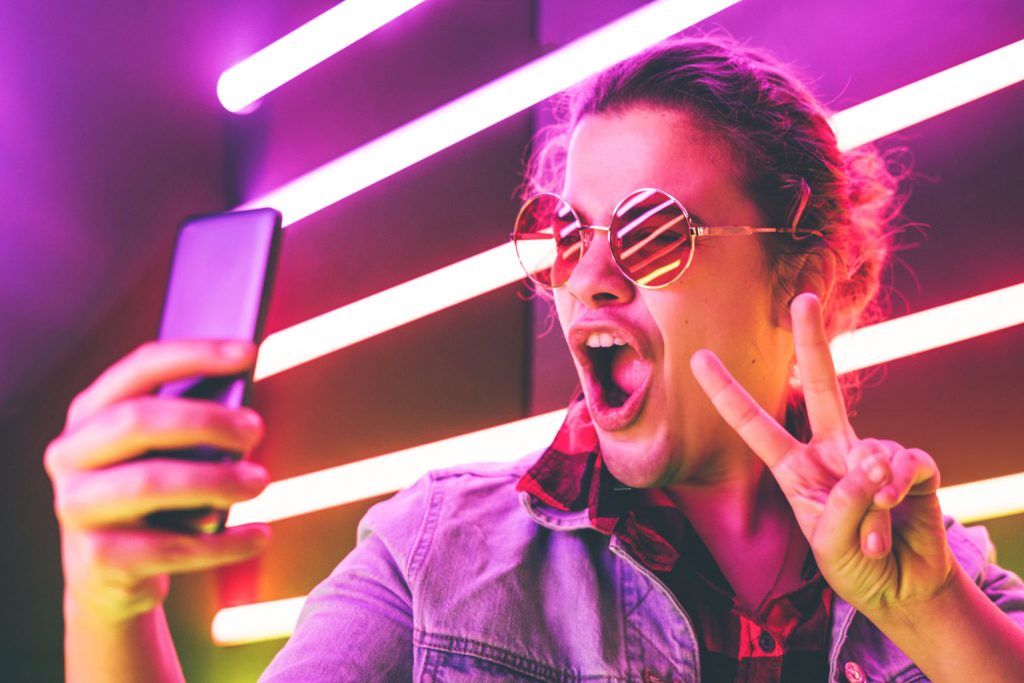 Girl taking selfie in the night club